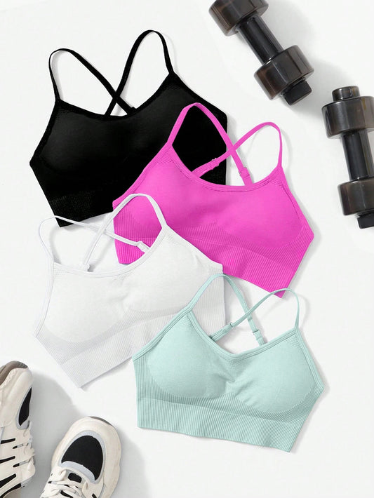 Set of four seamless sports bras with high stretch and crisscross back design, perfect for everyday wear.
