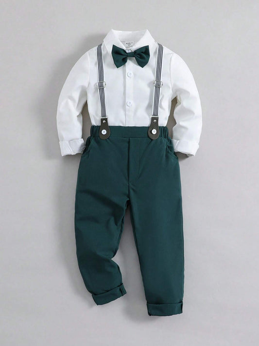 Set for young boys featuring a shirt with a bowtie and suspender pants, showcasing a gentleman style.