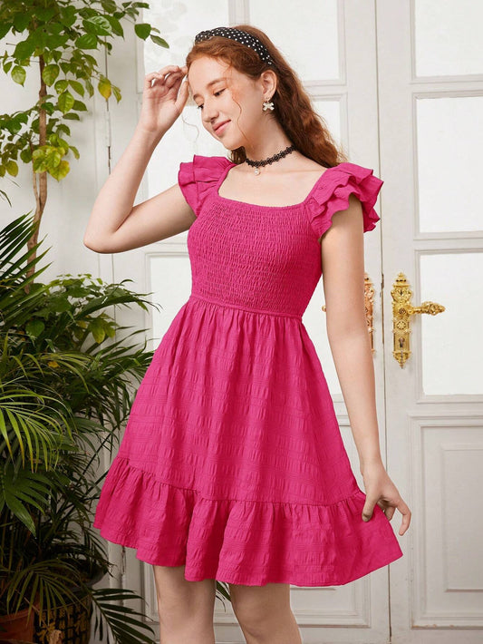 A shirred dress with short flutter sleeves in a solid color, ideal for summer and suitable for teenage girls.