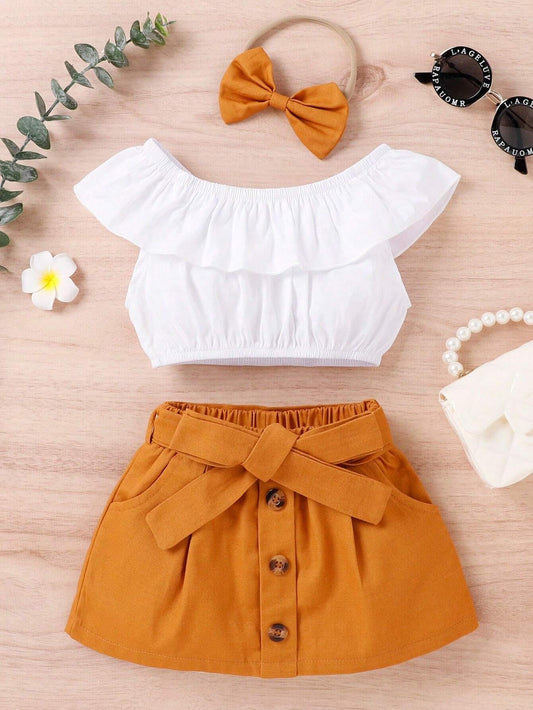 Crop top with ruffle trim, belted skirt, and headband set for young girls.