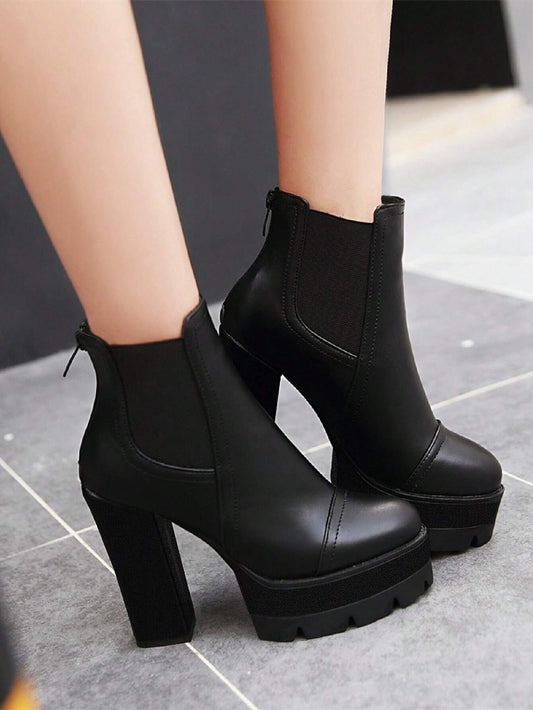 Ankle Boots in Black, featuring High Heels and Thick Heels for Warmth, with a Back Zipper for Outdoor Wear.