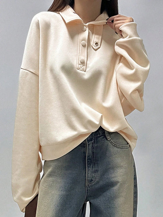 Women's Long Sleeve Sweatshirt with Half Placket and Drop Shoulder Buttons.