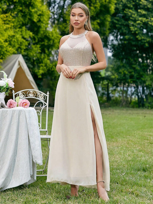 Bridesmaid Dress for Women with a Halter Neck, High Side Split, and Sparkling Panel.