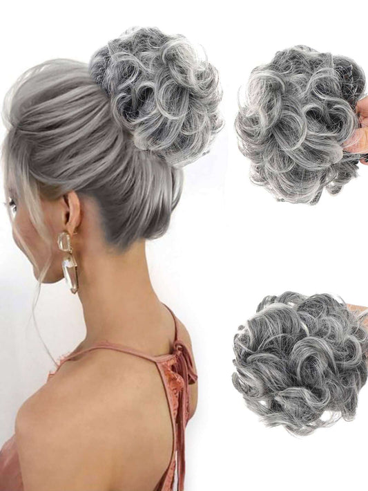 Grey chignon hair piece with messy wavy bun, secured with claw clip. Short curly hair bun extensions.