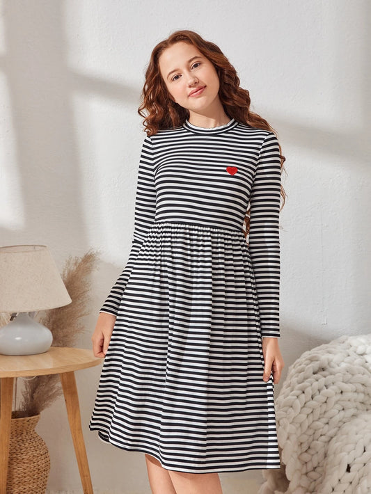 Mock neck dress with heart patches and striped design, tailored for teenage girls.