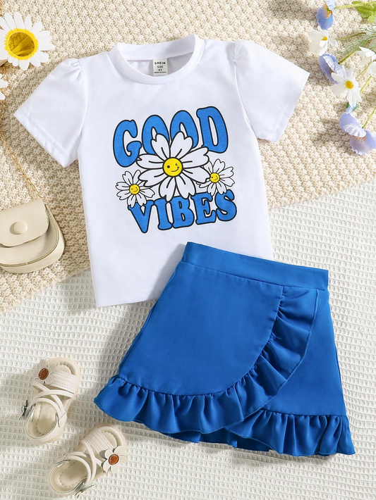 "A floral and letter graphic tee paired with a ruffle trim skirt for young girls."