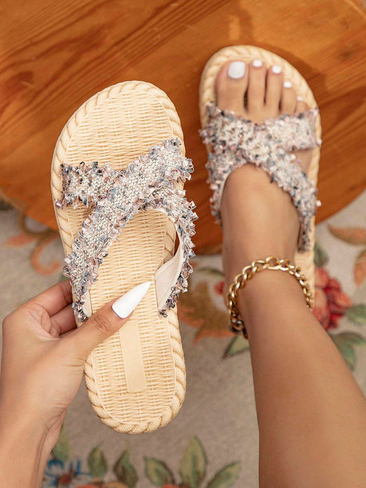 Summer vacation style sandals for women with a rattan weave bottom and jute string design.