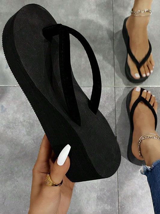 Minimalist flip-flops for women, featuring a fashionable black fabric design.