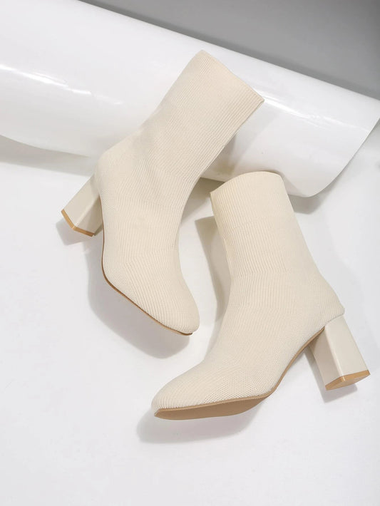 Stylish Women's Boots featuring a Minimalist Design and Chunky Heels, with Slip-On Sock Style.