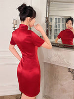 Dress with Split Hem, Mock Neck, and Button Front in a Solid Color