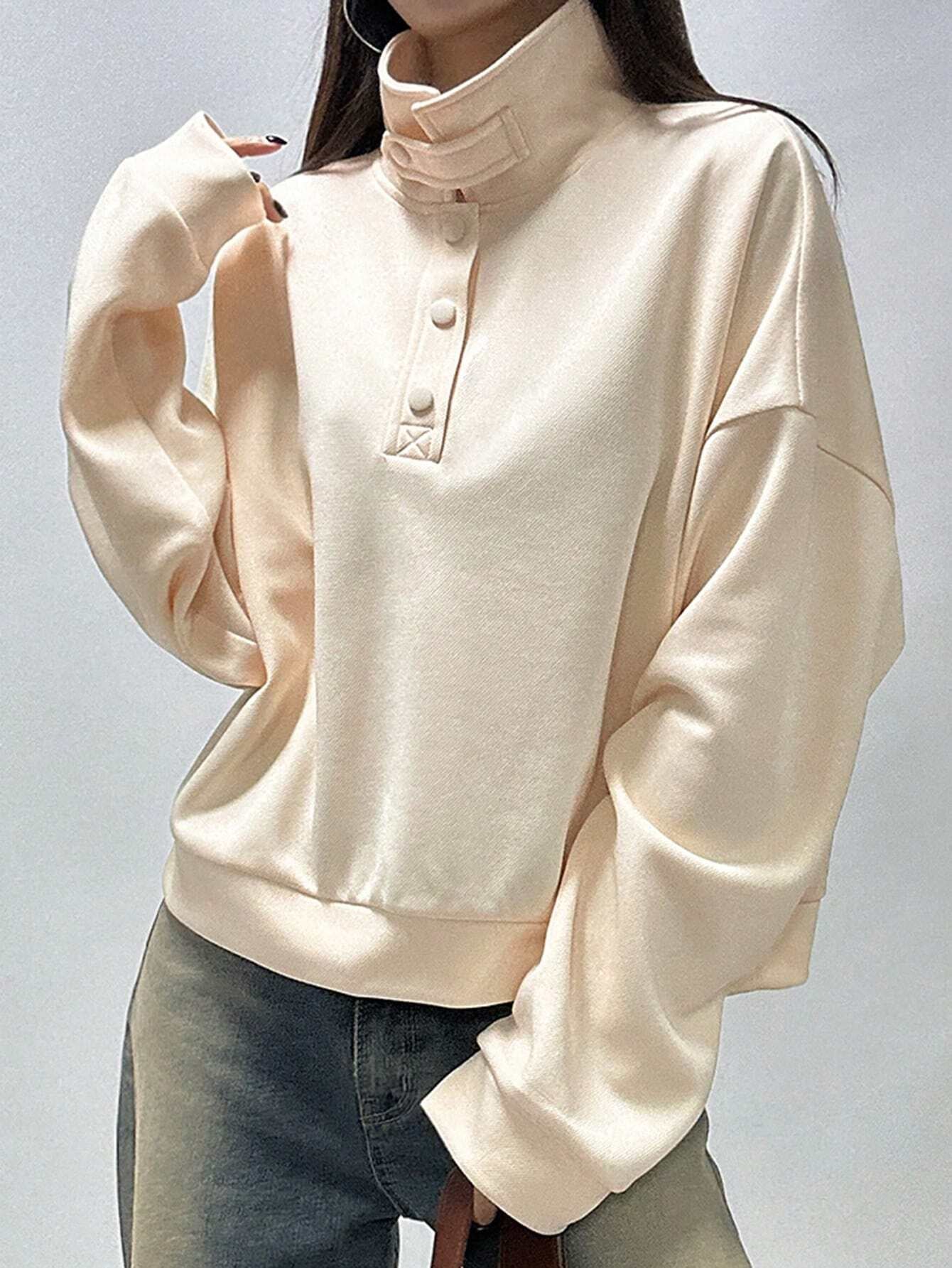 Women's Long Sleeve Sweatshirt with Half Placket and Drop Shoulder Buttons.