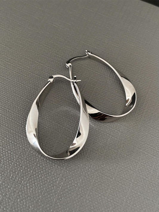 Pair of Fashionable Ladies' Earrings with Twist Mobius Loop Design.